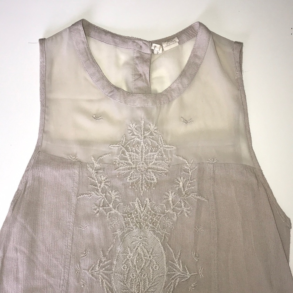 Tan beaded sleeveless shirt ( flower design )